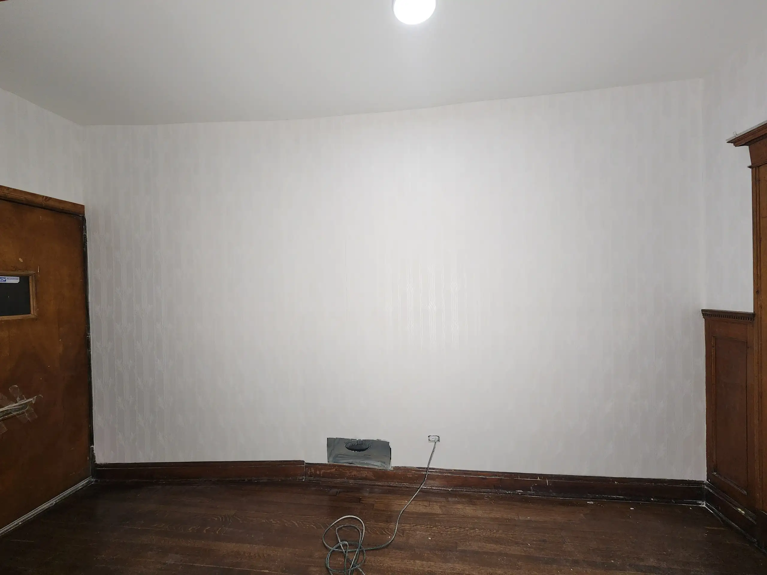 Completed wallpaper installation project featuring modern geometric pattern in New York